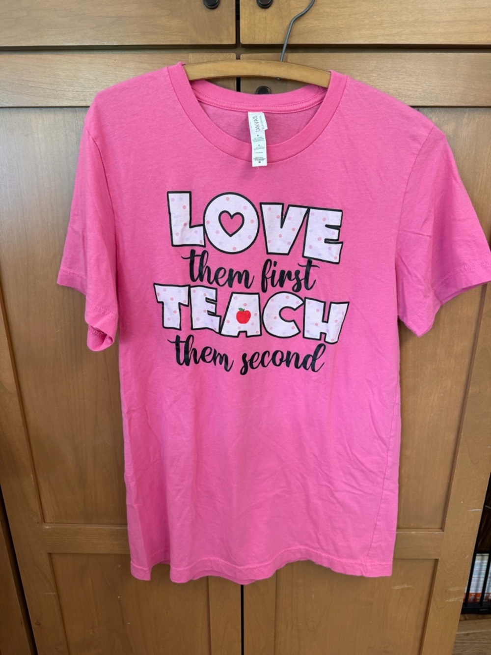 Bella Canvas Hot Pink 'Love Them First Teach Them Second' Graphic Tee